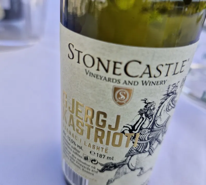 A bottle of Stone Castle Gjergj Kastrioti wine from Rahovec on the table
